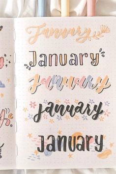 an open notebook with the words january written in cursive and handwritten letters