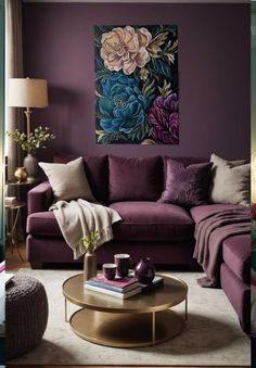 a living room filled with purple furniture and paintings on the wall above it's coffee table