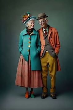 an older man and woman standing next to each other in front of a dark background