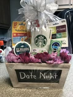 a starbucks gift basket with coffee, cookies and flowers in it that says date night