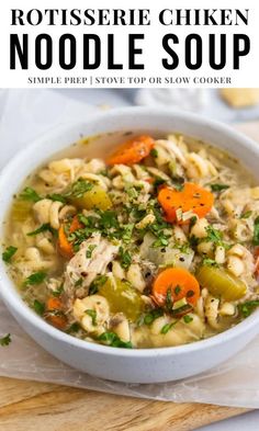 chicken noodle soup in a white bowl with carrots and celery