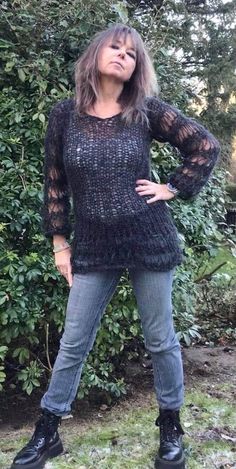 Unleash your inner Wednesday Addams with a gorgeous flattering jumper, knitted with a luxurious mix of alpaca and merino wool to create a knit which is light and airy with yarn over stitches to create holes for a punky goth grunge vibe. Hand knitted to order with love and care in the U.K., available in different sizes and a variety of colours.  XS Width 36cm  Length 78cm S    Width 40cm Length 80cm M   Width 44cm Length 82cm L    Width 50cm Length 84cm XL Width 54cm  Length 86cm The sizes might Fine Knit Mohair Sweater For Fall, Winter Mohair Knitted Tops, Fine Knit Mohair Tops For Fall, Black Mohair Crew Neck Sweater, Black Bohemian Sweater For Layering, Hand Knitted Black Sweater For Winter, Bohemian Chunky Knit Winter Top, Black Mohair Sweater For Winter, Black Mohair Winter Sweater