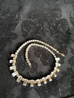 "Simple, classy & elegant Bridal Jewelry. Stunning piece for a Wedding! Authentic faceted Clear Rhinestone Necklace by Albert Weiss. Vintage 1942-1971. Signed on back of closure. Top of closure has 2 small rhinestones. Approximate measurements: 14.5\" long. Excellent vintage condition. No missing stones. International Shipping Insurance provided. A Hendersonville, NC estate find. #R2015-R9 Vintage, Home & Gifts www.MyVintageAlcove.etsy.com <-------- Shop the collection Shelf 7. Row 3. Classic Crystal Necklaces For Party, Classic Crystal Necklace For Party, Classic Bridal Crystal Necklace For Parties, Classic Rhinestone Necklaces For Formal Occasions, Vintage Crystal Necklaces For Weddings, Classic Evening Crystal Necklaces, Antique Crystal Necklace For Formal Occasions, Art Deco Crystal Necklaces For Formal Events, Classic Evening Crystal Necklace