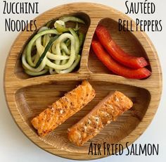 a wooden plate topped with different types of food