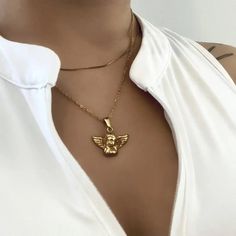 Cherub Necklace✨Catch the light with this stunning gold chain featuring an engraved Cherub charm! Wear alone or layer with your favourite gold chains. WHY ∙ YOU'LL ∙ LOVE ∙ IT• It's dainty and can be worn every day without tarnishing• Premium jewellery without a premium price• High-quality materials and attention to detail Gold cherub necklace with a 5cm (total 45 cm) extended chain so it is adjustable. This necklace is a hypoallergenic, minimalist and dainty necklace, perfect for layering with another chain! The pendant sits slightly above your breast bone. This is a handmade gold charm / pendant necklace. This has a stainless steel chain, so the chain will not rust when come into contact with a bit of water. Perfect for gifting, gift for friend, gift for herI’m happy to answer any questi Cherub Necklace, Guardian Angel Necklace, Angel Necklace, Charm Pendant Necklace, Handmade Gold, Guardian Angel, Dainty Necklace, Gold Charm, Steel Chain