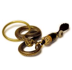 PRICES MAY VARY. This amazing keychain is made of brass, and its details are lifelike. It is suitable for car keys, gate keys, motorcycle keys, bicycle keys, etc. This key organizer and ring/clip are golden and suitable as a holiday gift for snake lovers, boyfriends, fathers and other people who pursue personalized decoration. It is suitable for hanging on jeans, backpacks, bags, wallet, knapsack and jackets. It can show your personality as a novelty ornament for DIY handmade craft. Its 8-shaped Snake Keychain, Key Chain For Men, Cool Snakes, Ring Clip, Snake Lovers, Chain For Men, Keychain Charm, Key Organizer, Car Personalization