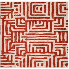 a red and white rug with an abstract design on the bottom, it is made out of