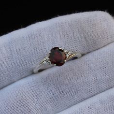 Garnet Crystal Ring For Anniversary, Garnet Birthstone Ring With Accent Stones, Garnet Birthstone Crystal Ring For Anniversary, Anniversary Garnet Crystal Ring, Anniversary Garnet Birthstone Crystal Ring, Red Crystal Ring With Stone Setting For Anniversary, Garnet Birthstone Ring With Accent Stones As Gift, Red Birthstone Ring With Round Stone For Gift, Red Crystal Promise Ring With Stone Setting