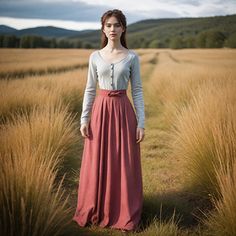 This elegant ensemble features a soft, heather gray long-sleeved top paired with a flowing, high-waisted coral skirt. The top is crafted from a comfortable, lightweight fabric, adorned with a simple button-down front, providing a classic and timeless look. The skirt, made from a breathable, airy material, drapes beautifully to the floor, offering both comfort and style. Its high-waisted design is accentuated with a delicate bow, adding a touch of femininity to the outfit. Perfect for a casual da Designer Image, Coral Skirt, Skirt Elegant, Dress Cottagecore, Dusty Rose Dress, Bodice Dress, Cottagecore Dress, Dress Dusty, Elegant Skirt