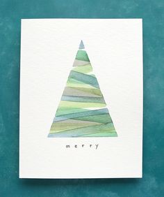 a card with a watercolor christmas tree on the front and merry written in black ink