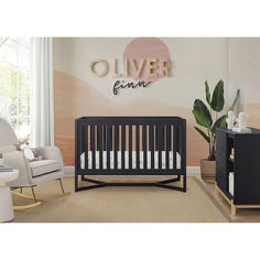 a baby's room with a crib and rocking chair