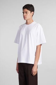 Atelier tee T-Shirt in white cotton, round neck, short sleeves, straight hem, boxy fit, 100% cotton, Made in Estonia, Model is 183 cm and wears size L White Classic Boxy Fit T-shirt, Modern Boxy Crew Neck T-shirt, White Boxy Classic T-shirt, White Boxy Fit Modern T-shirt, Modern White Boxy Fit T-shirt, Boxy White Short Sleeve T-shirt, White Boxy Short Sleeve T-shirt, Boxy White Cotton T-shirt, White Boxy Cotton T-shirt