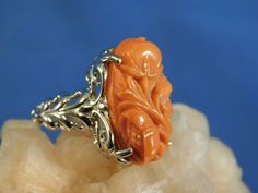 We offer free sizing, free shipping in the USA only, and a free appraisal upon request. If you are an international buyer, please contact us to work out shipping price. Also, we do not pay customs fees. Thanks. Sku: MJ1018 This is a 11.25 ct. Hand-Carved Pink Coral gemstone ring. This is a natural floral Coral in a sterling silver .925 setting. The ring was made in the USA by our staff gemologist and jeweler. Every ring is unique and one of a kind. The beautiful Coral is 14 mm x 22 mm. The total Elegant Carved Orange Jewelry, Elegant Orange Carved Jewelry, Coral Gemstone, Floral Ring, Sterling Silver Filigree, Ring Art Deco, Pink Coral, Solitaire Rings, Silver Filigree