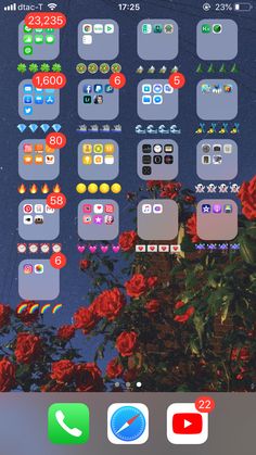 an iphone screen with various stickers on it and flowers in the foregrounds