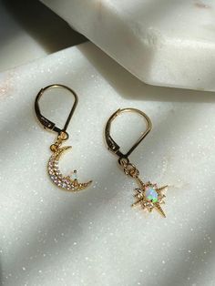 Moon and Star Opal Earrings-Gold Filled Earring Clasps-Dangle Earrings-Celestial Earrings-Gold Moon Earrings-Gold Star Earrings-Opal Earring~~~~~~~~~~~~~~~~~~~~~~~~~~~~~~~~~~~~~ITEM DETAILS* * Gold Plated Opal Moon 8x13mm* * Gold Plated Opal Star 10x13mm* * 14k Gold Filled Leverback earrings🔔✨🔔 Claim your 10% Coupon by signing up to our mailing list (copy and paste link on URL) https://www.subscribepage.com/pinkslate  🔔✨🔔--SHIPPING DETAILS--*No Invoices are included in the package*If standar Celestial Drop Earrings With Star Charm, Celestial Star-shaped Earrings For Pierced Ears, Celestial Star Charm Round Earrings, Celestial Dangle Earrings With Star Charm, Celestial Style Dangle Earrings With Star Charm, Celestial Crystal Pierced Earrings For Gift, Celestial Moon Shaped Earrings With Star Charm, Celestial Moon Earrings With Star Charm, Celestial Crescent Earrings With Star Charm