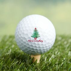 a golf ball sitting on top of a wooden tee