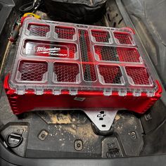 the inside of a car with some plastic containers on it