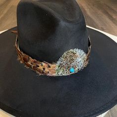 "Natural feather hat band. Brown feathers with black iridescent tips. Center crown measures 2.5\" W x 2.25\" H. Natural feathers Adjustable hatband *This product is for 1 single hat band. Hat not included." Adjustable Brimmed Felt Hat With Feathers, Adjustable Black Hat Band For Kentucky Derby, Adjustable Brimmed Fedora With Feathers, Adjustable Brown Fedora With Feathers, Adjustable Fedora With Feathers For Fall, Adjustable Feather Fedora For Fall, Adjustable Fedora With Feathers, Adjustable Top Hat With Feathers And Curved Brim, Adjustable Felt Hat With Feathers And Flat Brim