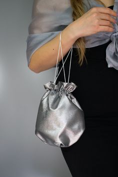 Elegant satin bag / money bag / purse ! Ideal for your wedding day, night out, party ,special occasion Made of beautiful silver grey bridal taffeta fabric. You can change colors Fabric : taffeta Lining : poliester Size : approx. 18 cm x 18 cm Elegant Gray Pouch Bag, Silver Pouch Evening Bag As Gift, Silver Pouch Bag For Gift, Elegant Metallic Bag For Gift, Elegant Metallic Bag As Gift, Elegant Metallic Bags For Gifts, Silver Evening Pouch, Silver Pouch Evening Bag For Events, Satin Evening Bag With Satin Lining For Parties