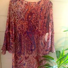 Beautiful New Preowned Mini Dress Never Worn With Tags Purple Beach Dress For Fall, Purple Paisley Print Dress For Spring, Purple Paisley Print Spring Dress, Purple Floral Print Tunic Dress, Purple Flowy Tunic Dress, Purple Printed Fall Dress, Purple Casual Dress With Vibrant Print, Purple Printed Dress For Fall, Purple Paisley Print Dress For Summer