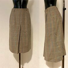 "70's Vintage Pencil Colorful Beige Checkered Wool Skirt Tartan Plaid Skirt Secretary Teacher Casual Warm Autumn Spring Skirt Size M/L ♥ Beige Lining ♥ Zipper and 1 button closure on Back ♥ Close Split on front ♥  2 pockets on sides Condition: Vintage condition : Verry good Tag: Daks London, made in Great Britain Materials: 100% pure wool Size: GB 12, D 38. F40. I 42 Measurements: Length: 70cm = 27,7\" Waist: 70cm = 27,7\" Hips: 106cm = 41,7\" **Measurements are taken with the garment lying flat. (Some sizes then doubled - Bust, Waist, Hips). Be sure to leave room for movement and comfort** Additional Notes: Please note that due to the nature of vintage clothing, ALL ITEMS ARE SOLD AS-IS; with no returns or exchanges, regardless of fit or condition. We try our best to give as much measurem Multicolor Midi Skirt For Workwear, Multicolor Mini Skirt For Workwear, Multicolor Mini Skirt For Work, Retro Fitted Skirt With Pockets, Retro High Waist Skirt For Work, Vintage Brown Skirted Bottoms, High Waist Retro Pleated Skirt, Retro Skirt For Workwear, Vintage Long Beige Skirt