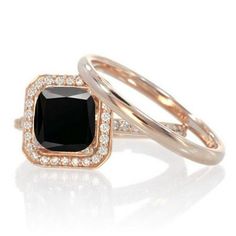 two gold rings with black and white diamonds on them, one has a square stone in the center