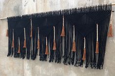 there are many tassels hanging on the wall