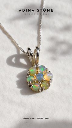 This flower-insipired necklace is set with beautiful Ethiopian opals with a magical color play made with 925 sterling silver ✨ Opal Necklace Gold, Beautiful Ethiopian, Ethiopian Opal Necklace, Ring Matching, Color Play, Matching Ring, Matching Rings, Opal Pendants, Opal Necklace