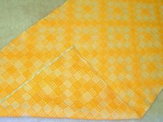 an orange and white checkered piece of cloth