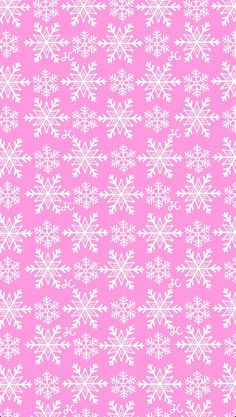 a pink background with white snowflakes on it