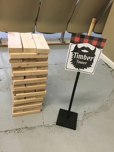 a pile of wooden blocks sitting next to a sign