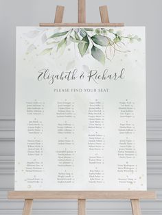 an easel with a wedding seating chart on it