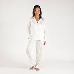 The Birdie Satin Pajamas are certain to become the most refined addition to your loungewear edit. These pajamas are made with luxurious, silky satin that washes beautifully. The button-front top has a notched collar and standard-length sleeves. These are the comfortable, relaxed PJs you’ll live in, gift to everyone, and pack with you wherever you go.Material: Poly-satin fabricSize & Fit: Fits for a more tailored style. Size up if in between sizes. 26.5" InseamCare guide: Machine wash cold with l Elegant Satin Sleepwear For Lounging, Elegant Satin Loungewear, Elegant Silk Sleepwear With Relaxed Fit, White Silk Long-sleeve Sleepwear, White Silk Long Sleeve Sleepwear, Button Front Top, Satin Pajamas, Birdy, Length Sleeve