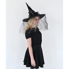 Skeleteen Classic Witch Headpiece is the ideal headwear for any woman dressing up as a cute witch Halloween. This beautiful witch hat can be worn for many style witches, a wicked one, a vintage one, a Victorian one, a creepy one, or a classy one. This hat is made of fancy black fabric, Satin-Feel and has cool decorations on the side that include a black bow with beads, a black veil with spiders hanging down, and some black feather accents. This big felt hat is made to fit most women's heads. Ske Black Witchy Hat For Halloween, Witchy Black Costume Hat For Fall, Witchy Black Costume Hats And Headpieces For Fall, Black Fitted Witchy Hat, Fitted Black Witchy Hat, Black Witchy Brimmed Costume Hat, Witchy Black Brimmed Costume Hat, Black Brimmed Witchy Costume Hat, Witchy Wide Brim Costume Hat For Party