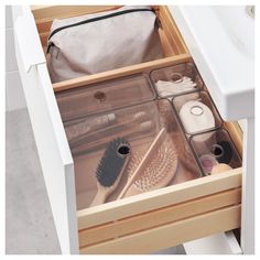 an open drawer with various items in it