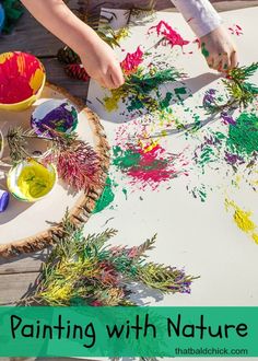 children are painting with nature paper on the table