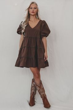 A day in the life of a fashion icon because you in this dress is stunning!!! Dark brown short puff mini dress, tiered style, dress is lined  Material is Polyester  Hang to dry  Model is 5’7 wearing a small  SHOP THE LOOK    Small Medium Large  Length  30” 31” 32” Bust 18” 19” 20” Brown Dress Outfit, Country Concert Dress, Puff Mini Dress, Wedding Guest Romper, Christmas Formal, Concert Dress, Country Dress, Party Bottoms, Girl Western