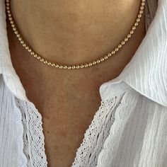 This feminine 4mm gold necklace is made with high quality round 14K gold filled beads for long, durable wear.    The 4mm beads are strung on strong 21 micro woven stainless steel beading wire with nylon coating. I use only the finest bright gold filled findings. A large clasp that is easy to hold and open completes this necklace. A 2" necklace extender is included, so you can adjust the necklace and wear it at different lengths. Please message me if you would like the necklace without the extend Affordable Cream Round Bead Necklace, Gold Minimalist Single Strand Beaded Necklace, Minimalist Single Strand Gold Beaded Necklace, Minimalist Gold Single Strand Beaded Necklace, Delicate Gold Beaded Necklace With Round Beads, Classic Gold Beaded Necklaces For Everyday, Simple Beaded Necklaces, Feminine Minimalist, Elegant Choker