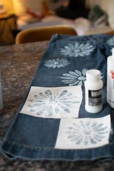 the table is covered with various items such as toothpaste, glue and fabric