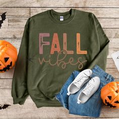 Embrace the essence of autumn with our Fall Vibes sweater, designed to capture the vibrant hues of the season. Featuring a stunning array of fall colors, this shirt is perfect for cozy gatherings, crisp walks, or simply celebrating the beauty of fall. Made from soft, breathable fabric, it ensures comfort while showcasing your love for all things autumn. Get ready to turn heads and spread those fall vibes wherever you go! Product features - Medium-heavy fabric blend of 50% cotton and 50% polyeste Cozy Fit Fall Sweatshirt, Fall Sweater With Letter Print And Relaxed Fit, Trendy Cozy Fit Sweatshirt For Fall, Relaxed Fit Letter Print Fall Sweater, Relaxed Fit Sweater With Letter Print For Fall, Green Cotton Sweater For Fall, Cozy Fall Sweater With Graphic Print, Green Relaxed Fit Sweater For Fall, Cotton Sweater For Fall