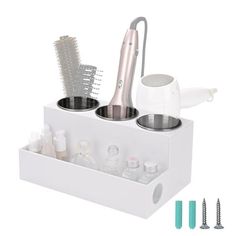 a hairdryer, brush and other items in a container on a white background