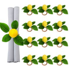 a bunch of lemons with green leaves on them are arranged in the shape of rings