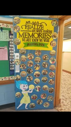 a bulletin board with pictures on it in the hallway next to a door that says, we are making memories we don't know we were having fun