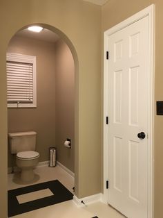 an empty bathroom with a toilet and sink