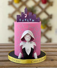 a cake with a doll on top of it