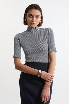 Feel Elevated In Our Knit Top, With A Universally Flattering, Fitted Silhouette, And A High, Funnel Neckline. Style This Piece With Jeans Or Tailored Trousers For An Outfit That Will Take You From Office Days To Wintery Walks, Then Pair With A Midi Skirt For More Elevated Occasions. Stripe Funnel Neck Short Sleeve Knit T-Shirt High Quality, Soft Knit Fabric High, Funnel Neckline Fine, Vertical Stripe Pattern Short, Flared Sleeves Comfortable, Figure Hugging Silhouette Chic Striped Fitted Sweater, Striped Fine Knit Crew Neck Top, Fine Knit Striped Tops For Spring, Striped Knit Tops With Short Sleeves, Striped Textured Knit Crew Neck Top, Striped Knit Sweater With Short Sleeves, Modern Fitted Crew Neck Sweater, Striped Stretch Knit Top With Crew Neck, Striped Knitted Crew Neck Tops