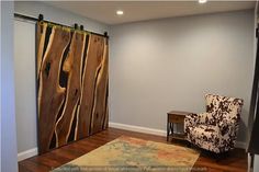 a living room with a chair and sliding door