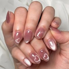 manicure in a light pink color and nails are oval-shaped and have a metallic sheen with two small hearts, one on each finger, painted in a white color. march nails ideas, march naild inspo, spring nails trend Magnetic Heart Nails, Heart Cat Eye Nails, Cat Eye Nails Polish, Pink Manicure, Blush Nails