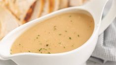 a white gravy dish with crackers on the side