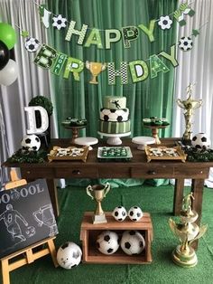 a soccer themed birthday party with green and white decorations, balloons, and desserts